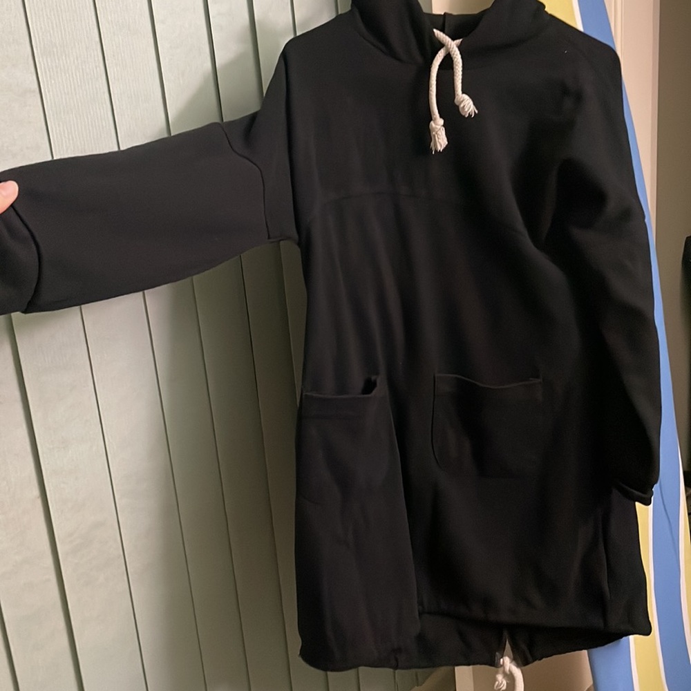 That is a sweatshirt. It is long and very black. - Picture 2 of 4